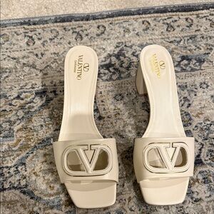 Valentino Women's Cream Logo Mules V logo cut out